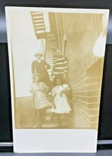 RPPC - Family of Four Standing and Posing on Outdoor Stairs 