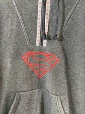 Warner Bros. Superman fleece hoodie pulled over. Draw String Hem. Stitched logo