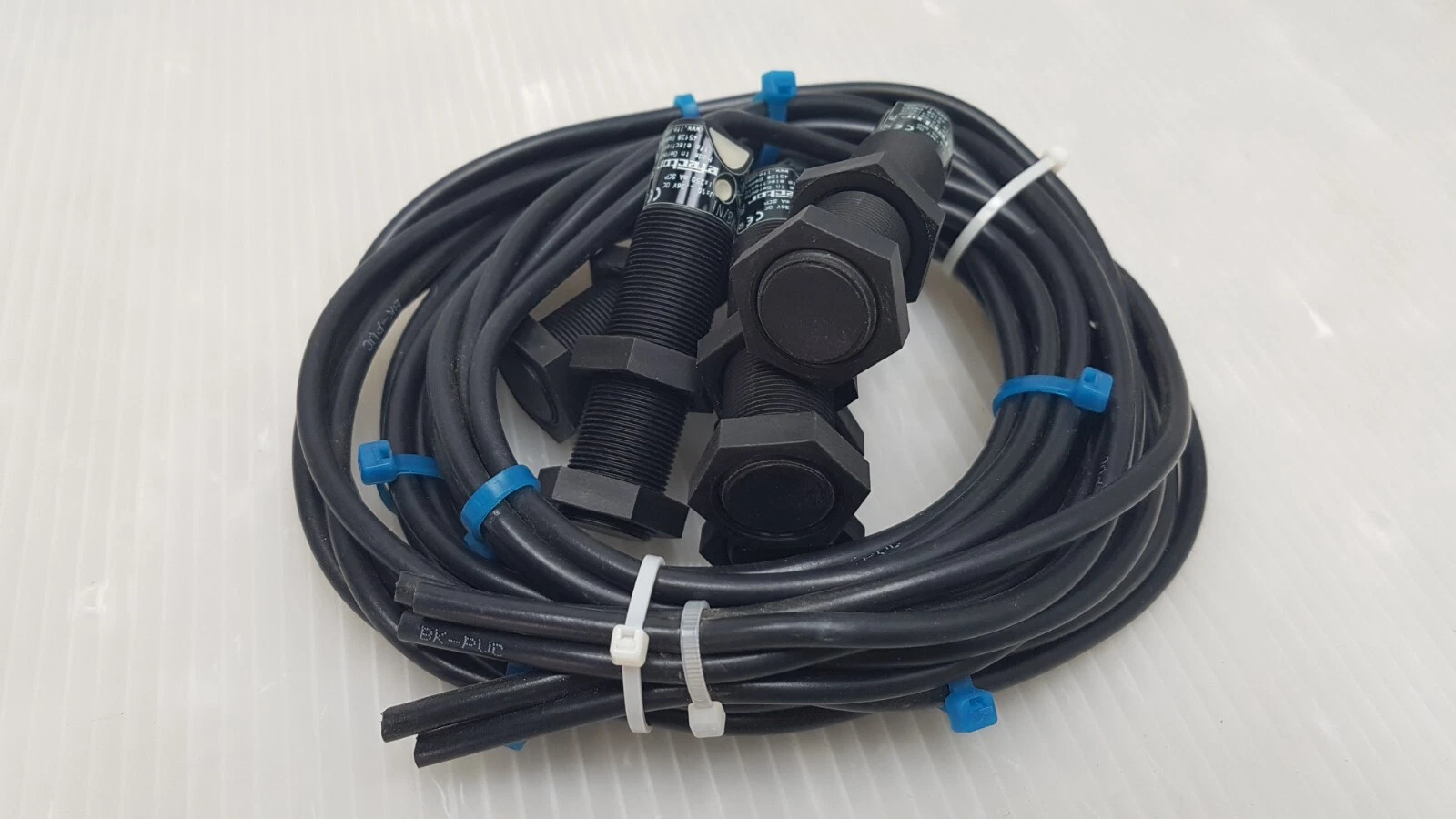 Lot of ifm KG5034 capacitive sensors with M18 nuts and coiled black cables