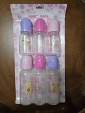 6-pack of "Honey Baby" brand feeding bottles, featuring colorful caps and bears