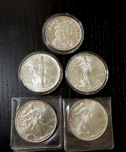 4 1 Oz. Silver Dollars 2x 1995, 1997, 1998. + 1x 1996 Happy Birthday 1 Oz. Coin
