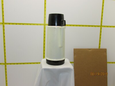 The listing is for:Used Vintage White & Black Thermos Super Quart Vacuum thermos