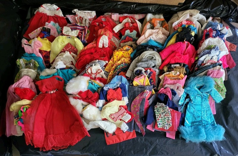 A Mix of Vintage and Modern Barbie and Ken Doll Clothes Maybe Skipper.