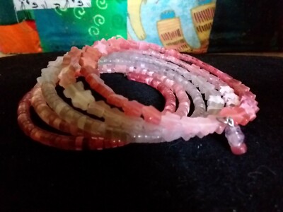 Bracelet in shades of pink tiger's eye stars and heishi beads on memory wire