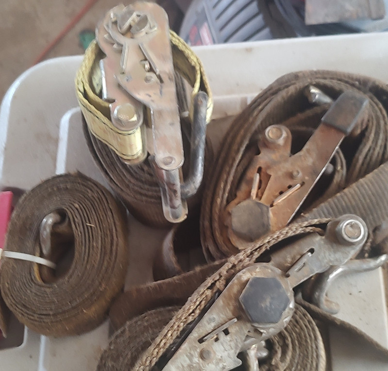 Three Used Brown Ratchet Tie Down Straps With Extra Strap
