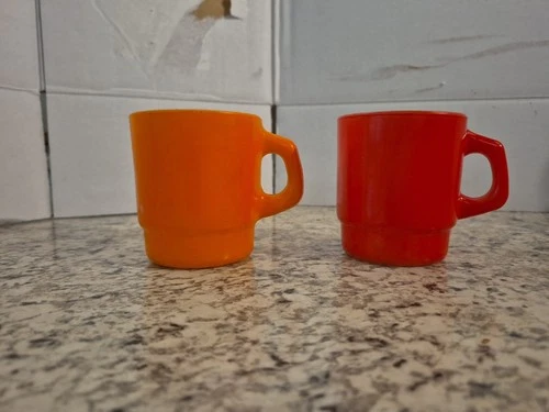 Vintage Pair of Anchor Hocking Fire King Stackable Mugs Orange And Red