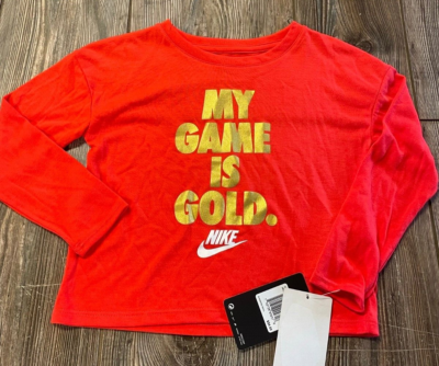 red and gold nike shirt