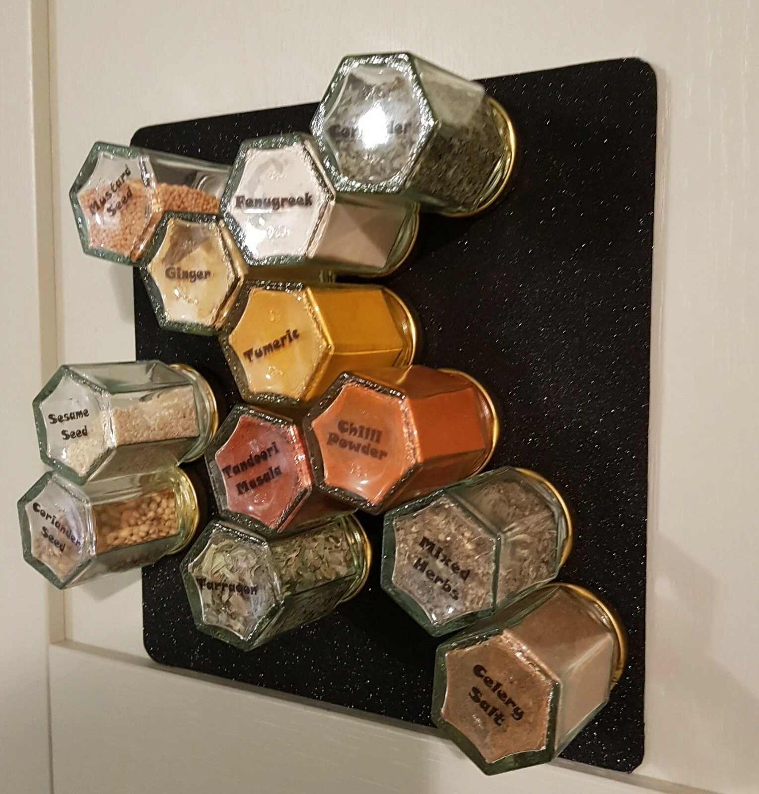 Magnetic wall mounted sheet & 12 X 4oz airtight jars on black sparkly sheet