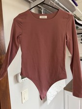 Babaton Women  s Pink Solid Long Sleeve Bodysuit One Piece, Size M Regular