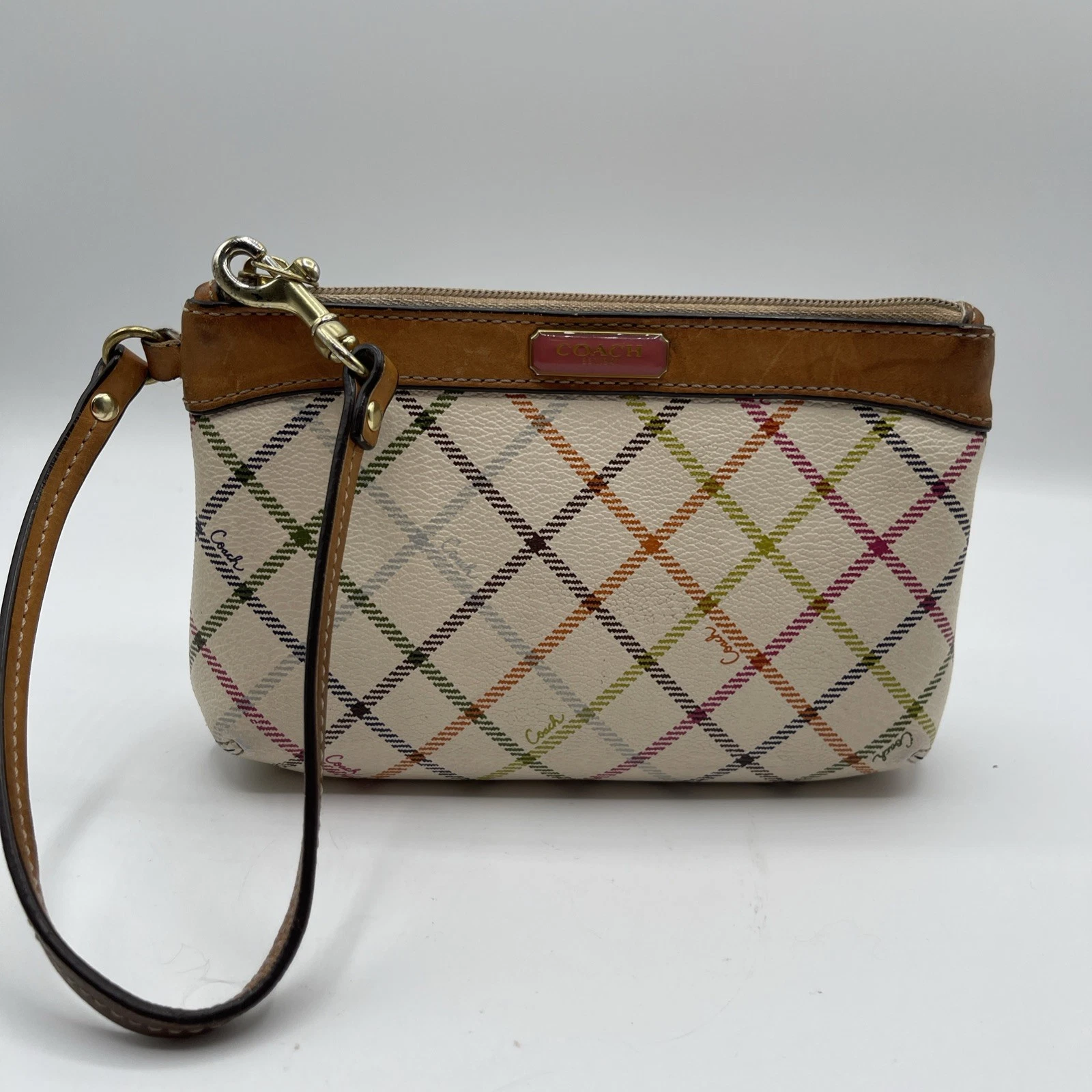 Coach Peyton Tattersall custodia da polso con bordo in pelle marrone placca logo