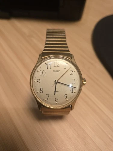 Timex Mens Gold Tone Thin Stretch Hand Wind Mechanical Watch. Water Resistant.