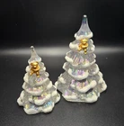 2 Fenton Art Iridescent Pearl Christmas tree figurines w/ gold-tone teddy bears.