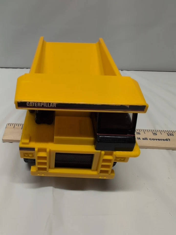Camión de volteo Caterpillar 9" de largo caja de fósforos plástico funciona con pilas no funciona  Foto 3 de 4