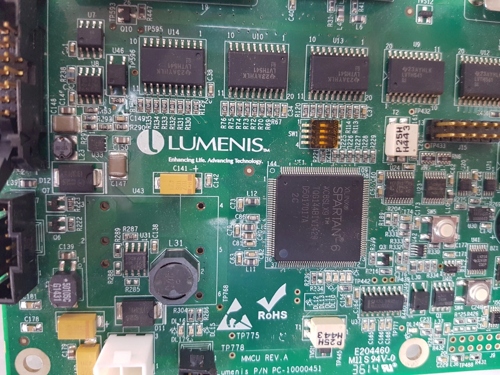 Close-up of the Xilinx Spartan-6 XC6SLX9 FPGA next to the Lumenis logo on the PC-10000451