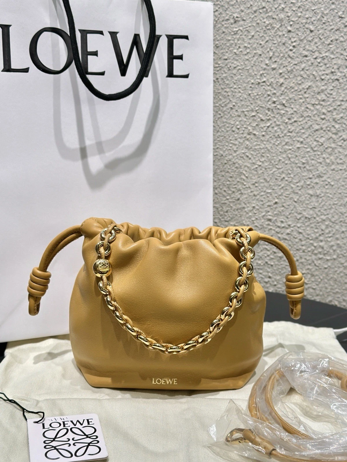Loewe — Authentic Pre-owned LOEWE flamenco Chain Drawstring Bucket Bag in Tan Calfskin
