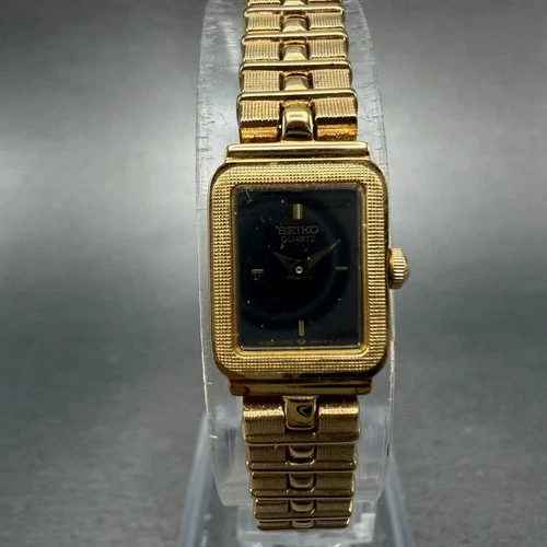 Seiko Watch Women 13mm Black Dial Gold Tone Rectangle 1E20-5689 New Battery NOS