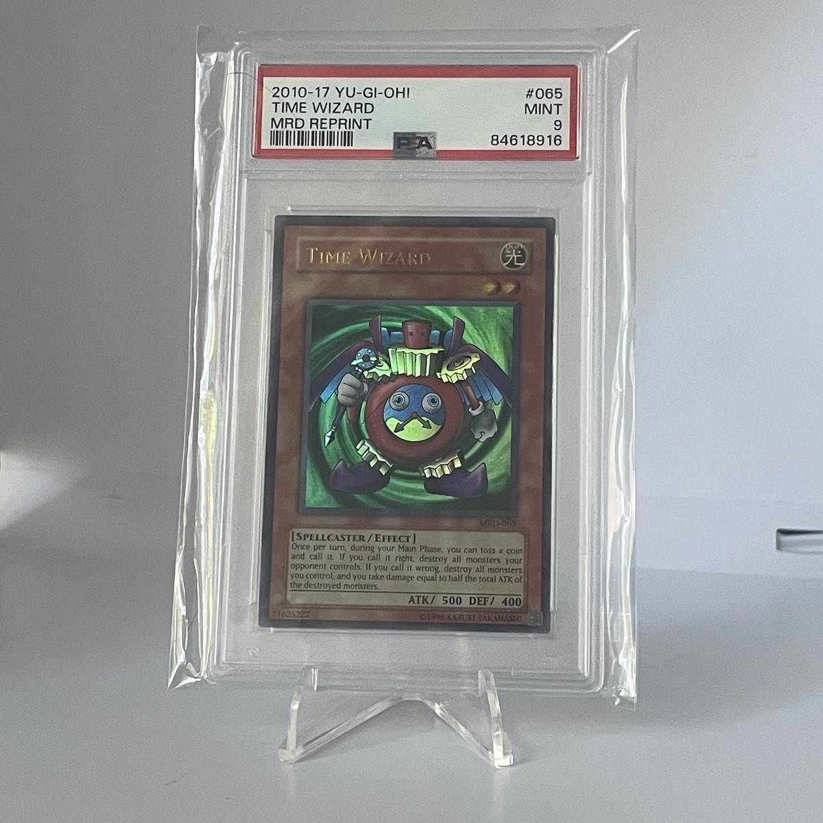 Rare YuGiOh Time Wizard EN065 2010-17 MRD Reprint PSA 9 TCG Metal