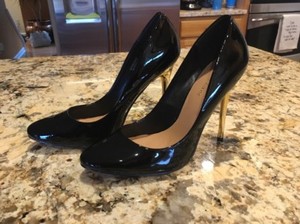 black heels with gold heel