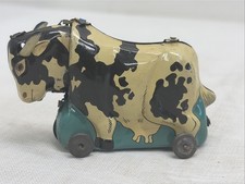 Vintage Tin Litho Cow Toy on Wheels. Made In Japan Black White