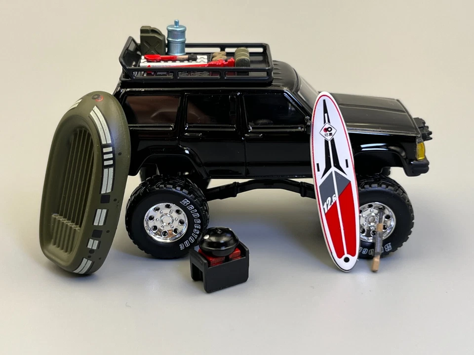 Jeep Cherokee XJ Bigfoot Rock Crawler PopRace 1/64 Scale with Accessories - Image 3 of 4