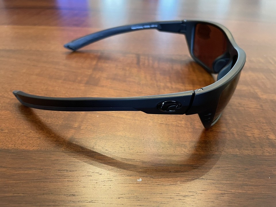 Costa Del Mar Whitetip polarized 580G sunglasses. BlackoutCopper Glass