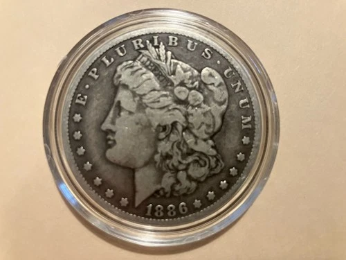 1886 0 US Morgan Silver Dollar, 99% Pure Silver, Very Good Condition.