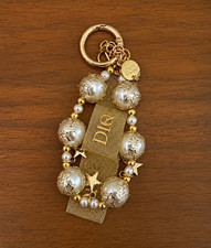 Brand new unopened Dior Gold Tone Key Chain Star Charm White Pearl Beaded