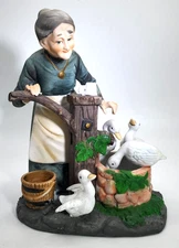 Lefton, Contented, Elderly Lady Watering a Few Thirsty Ducks Figurine