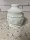 Vintage Wheaton milk glass covered jar with eagle coin pattern.