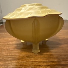 Classic 1940s dark Yellow color footed powder...