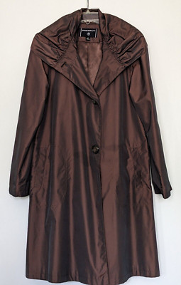 Women rain coat in brown color and lining.