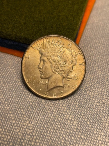 (#101406) Peace Dollar: 1927.  AU.   nice original toning. See video