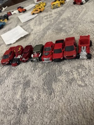 8 red hotwheels different colors and designs shown in pictures