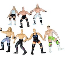 Lot of (7) WWE Action Figures-Billy Gunn-Hunter Hearst-Owen Hart & More