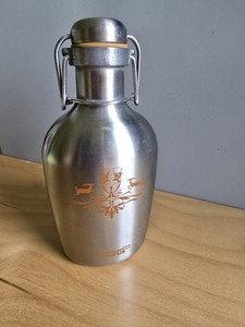 This is a vintage Sigg stainless steel water bottle swing-top lid