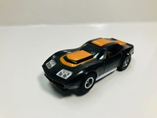 AFX tras BLACK / ORANGE  CORVETTE AW Chassis  Display case Aurora NEW 