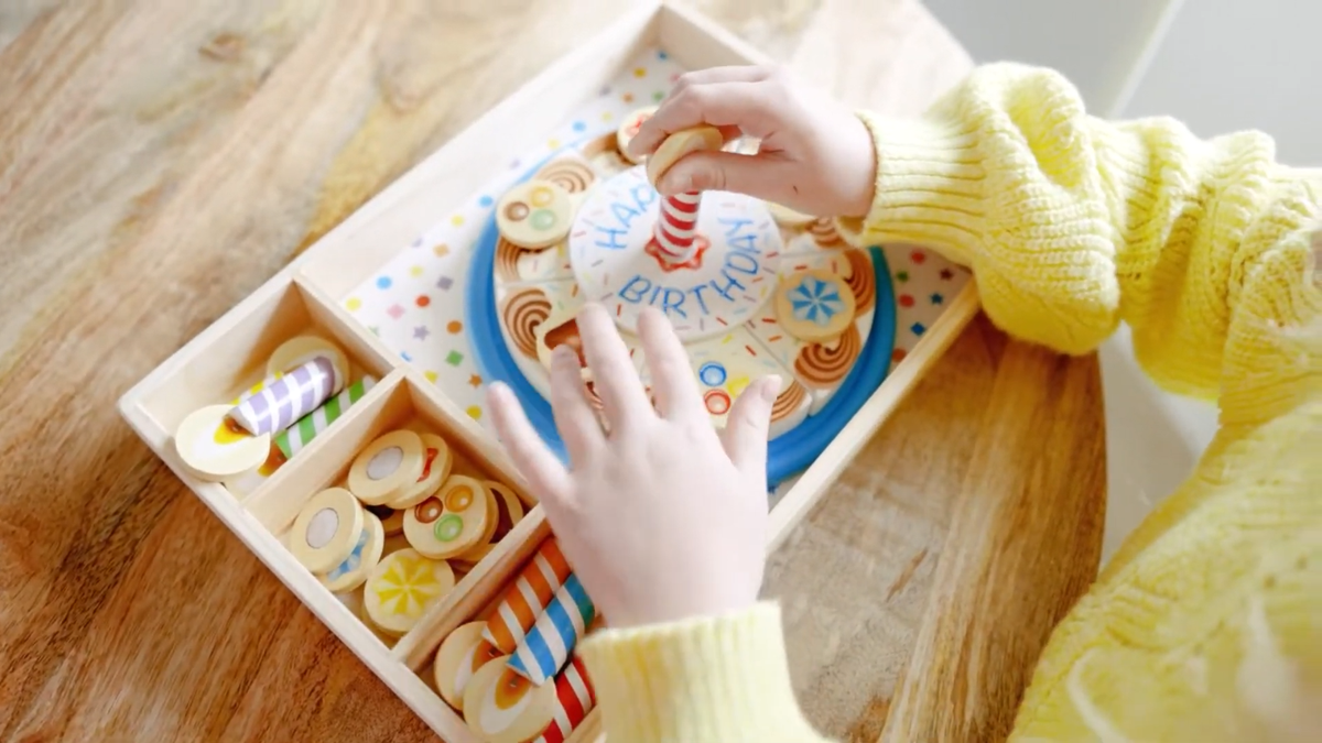 Someone’s in a Melissa & Doug Triple-Layer Party Cake Mood