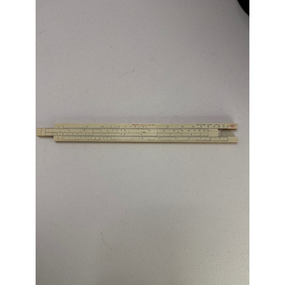 A Japanese-made Frederick Post slide rule in a Pickett box — a cross-brand vintage quirk that tells its own little story of mid-century engineering culture.