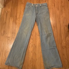 Vintage 1970  s bell bottom faded jeans. Ste. Lucien 33 X 36 distressed well worn