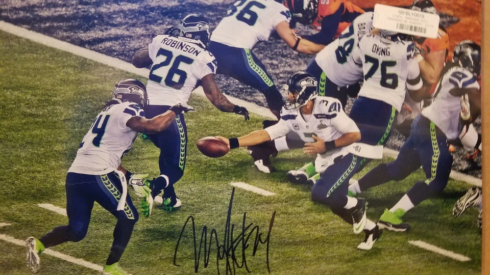 Foto autografiada por Marshawn Lynch Seattle Seahawks 16" x 20" Super Bowl XLVIII Foto 3 de 4