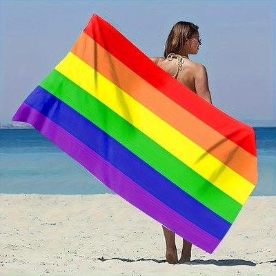 A Single Piece of Beach Towel Featuring a Rainbow Stripe Design, Highly Absorb