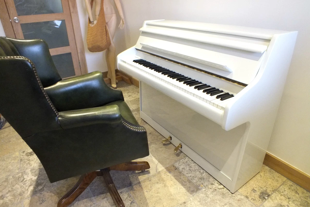 Compact piano on sale