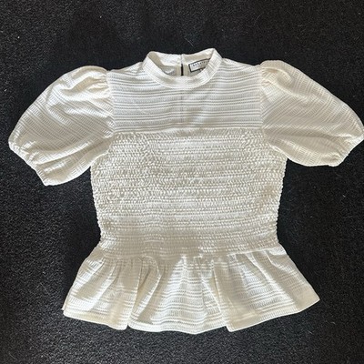 Bagatelle Women s Smocked Peplum Top Size M Crème White Puff Sleeve Blouse