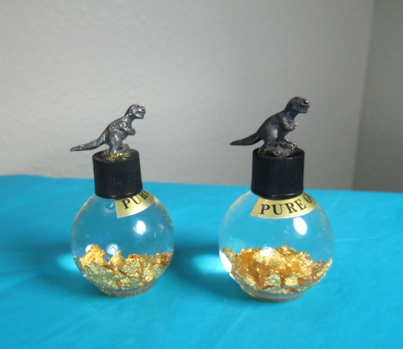 Two Pure Gold Flake 24k Bottle 2 3/8" Round Glass Dinosaur Pewter Figure Scrap