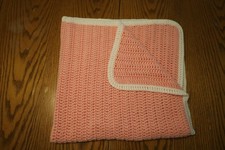 HAND MADE PINK CROCHET SOFT BABY BLANKET WITH WHITE TRIM APPROX. 35 X 37