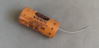 used ASTRON 100 uF 200V Electrolytic Capacitor Minimite brown cardboard cover