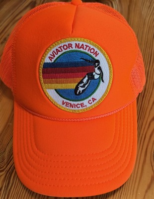 Aviator Nation Signature Venice Vintage Nylon Trucker Hat in neon orange. Signature Venice Vintage Nylon Trucker Hat | Aviator Nation main image 2