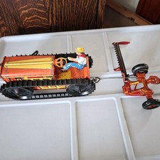 Marx Working Wind Up Tractor With Tin Litho Driver And Rear Rake.