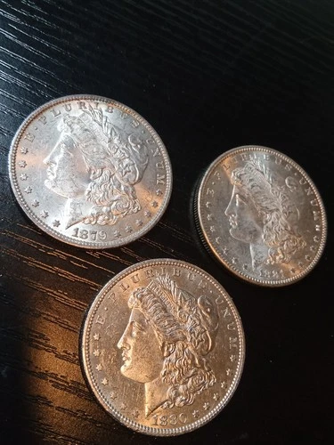 3 silver BU Morgans. 1879-O, 1880-S, 1881-S. Pretty. No reserve.