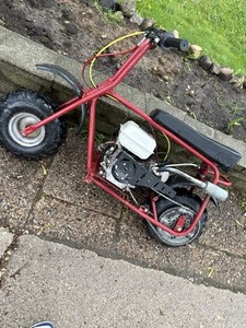 Red Mini Motorcycle Gas Scooter with Integrated Footrest and Black Seat